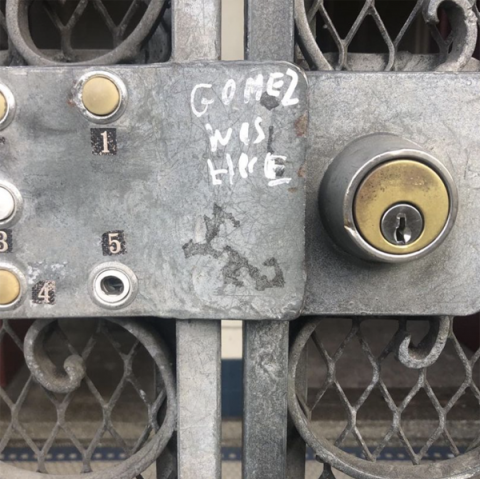 Gate lock with the words "Gomez was here."