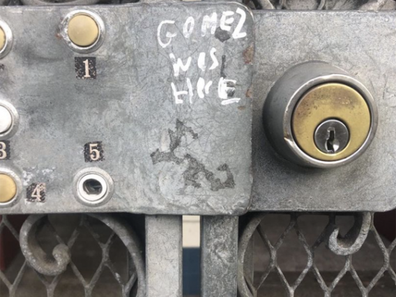 Gate lock with the words "Gomez was here."
